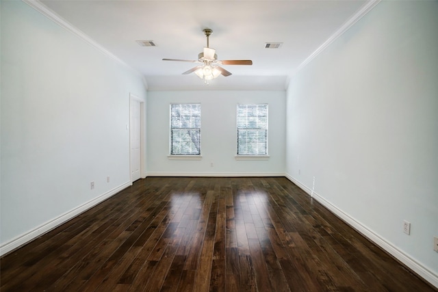 spare room featuring ceiling fan, ornamental molding, and visible vents