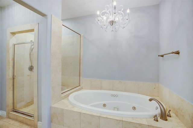 full bath featuring a whirlpool tub, an inviting chandelier, and a stall shower