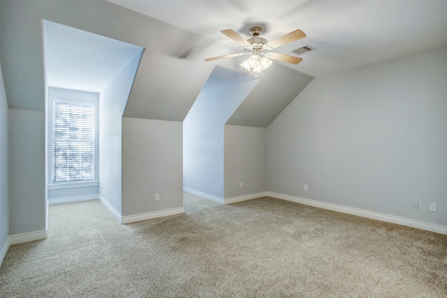 bonus room with vaulted ceiling, visible vents, baseboards, and carpet