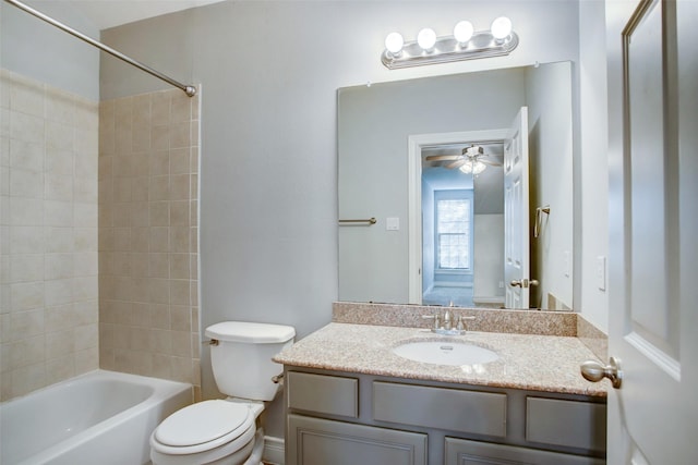 full bath with vanity, a ceiling fan, toilet, and shower / tub combination