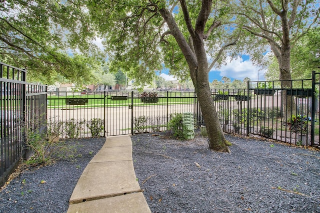 view of gate with fence