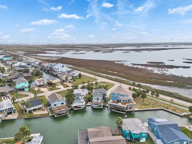 bird's eye view featuring a residential view and a water view