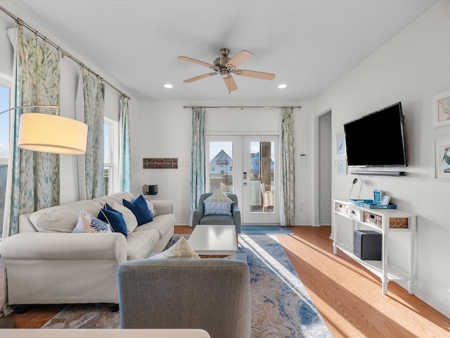 living room featuring a healthy amount of sunlight, recessed lighting, and wood finished floors