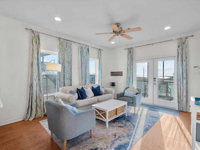 living area featuring a ceiling fan, french doors, recessed lighting, and wood finished floors