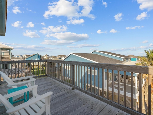 wooden terrace with a residential view