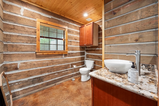 bathroom featuring wooden walls, toilet, vanity, and wood ceiling