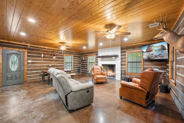 living area with concrete flooring, a ceiling fan, and visible vents