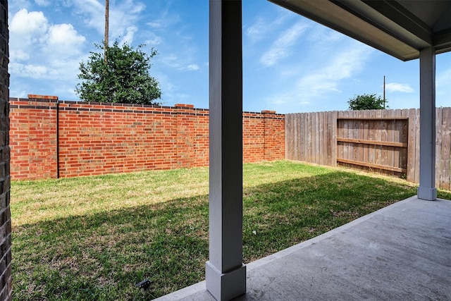 view of yard featuring a patio and fence