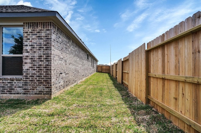 view of yard with a fenced backyard