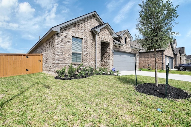 french country inspired facade with brick siding, a front yard, a garage, and concrete driveway