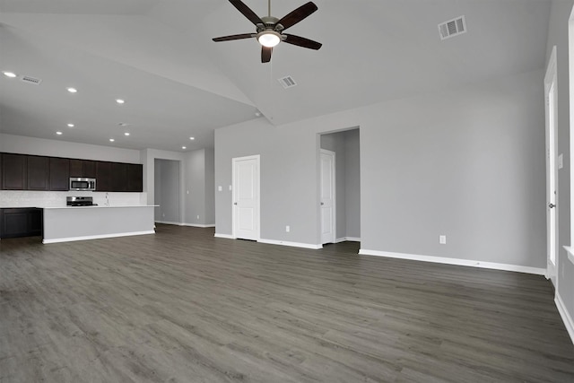 unfurnished living room with high vaulted ceiling, wood finished floors, ceiling fan, baseboards, and visible vents