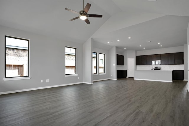 unfurnished living room with dark wood-style floors, baseboards, recessed lighting, a ceiling fan, and high vaulted ceiling