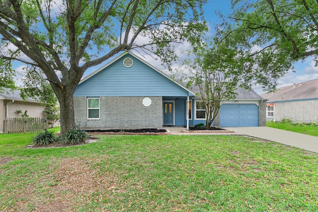 ranch-style home with driveway, an attached garage, a front lawn, brick siding, and fence