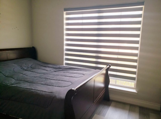 bedroom with wood finished floors
