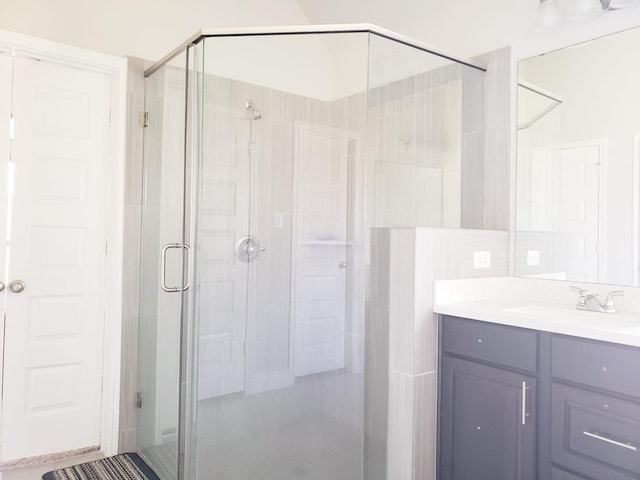 bathroom with vanity and a stall shower