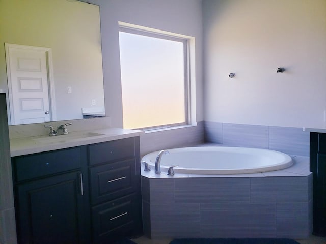 full bathroom with vanity and a garden tub