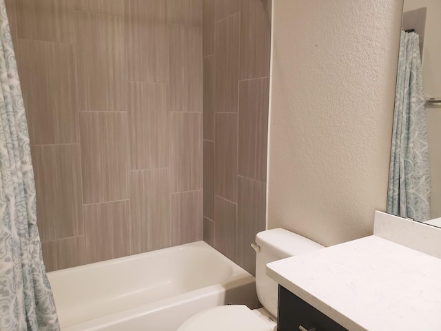 bathroom with toilet, a textured wall, shower / bathtub combination with curtain, and vanity