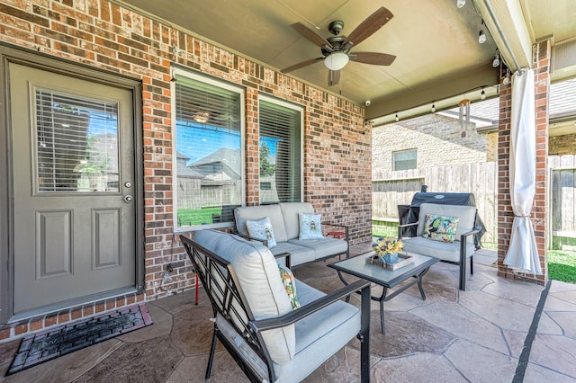 view of patio featuring fence, a ceiling fan, and outdoor lounge area