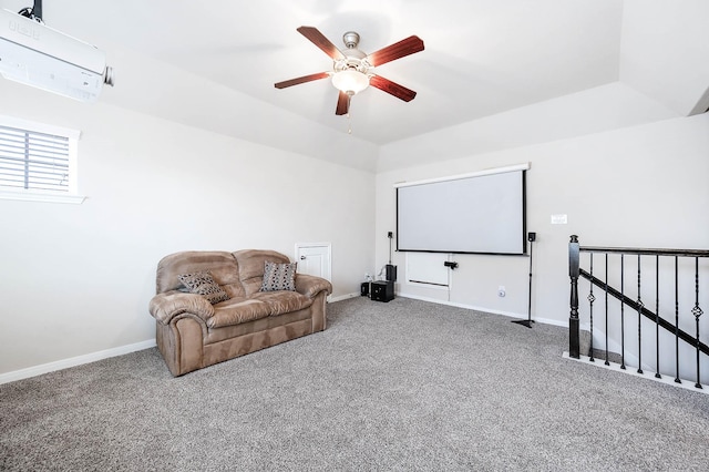 carpeted home theater room with baseboards, ceiling fan, and lofted ceiling