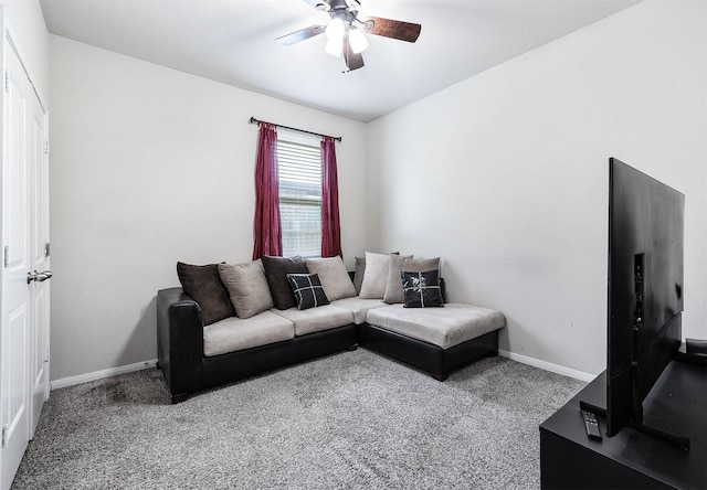 living room featuring carpet floors, a ceiling fan, and baseboards