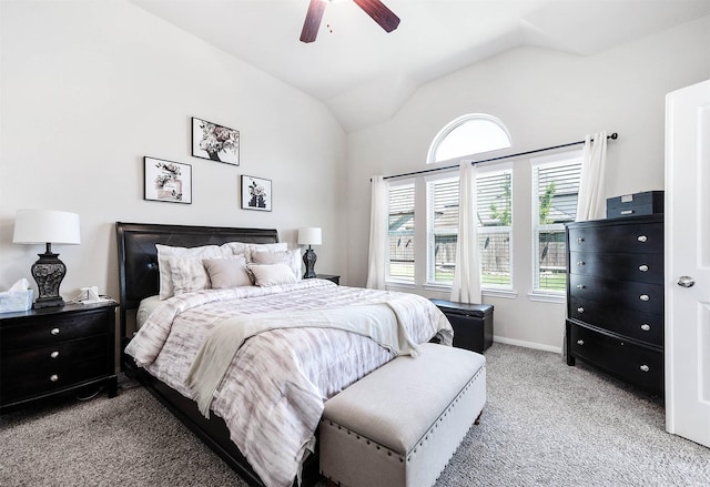 bedroom featuring a ceiling fan, baseboards, vaulted ceiling, and light carpet