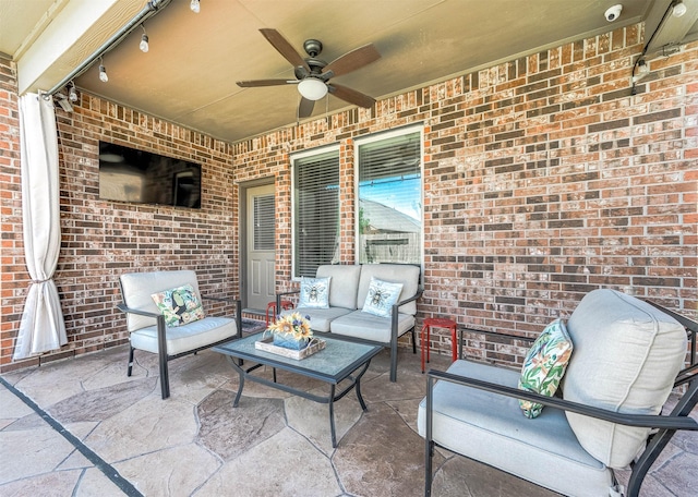 view of patio with outdoor lounge area and a ceiling fan