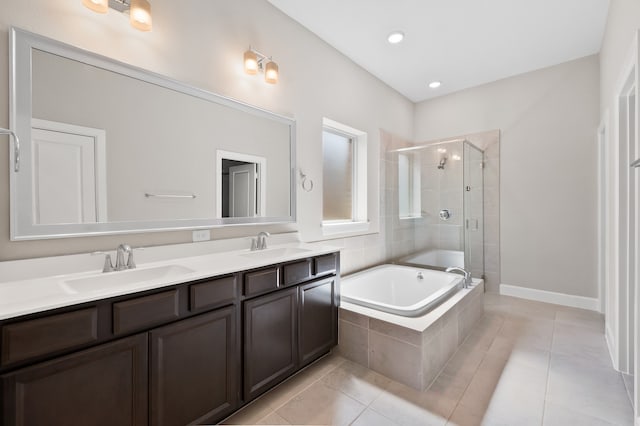 10723 Bridgeport Path Ct, Missouri City, TX 77459 - full bathroom featuring a sink, tile patterned flooring, a garden tub, and a stall shower