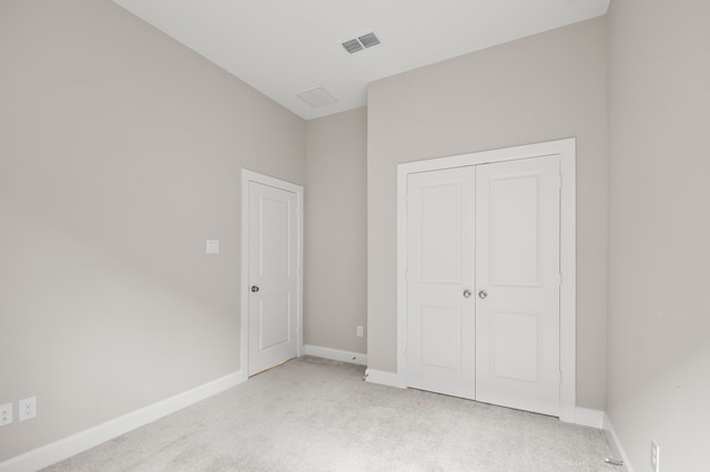 10723 Bridgeport Path Ct, Missouri City, TX 77459 - unfurnished bedroom featuring baseboards, visible vents, light carpet, and a closet