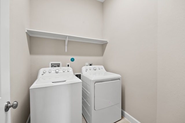 10723 Bridgeport Path Ct, Missouri City, TX 77459 - laundry room with independent washer and dryer, laundry area, and baseboards