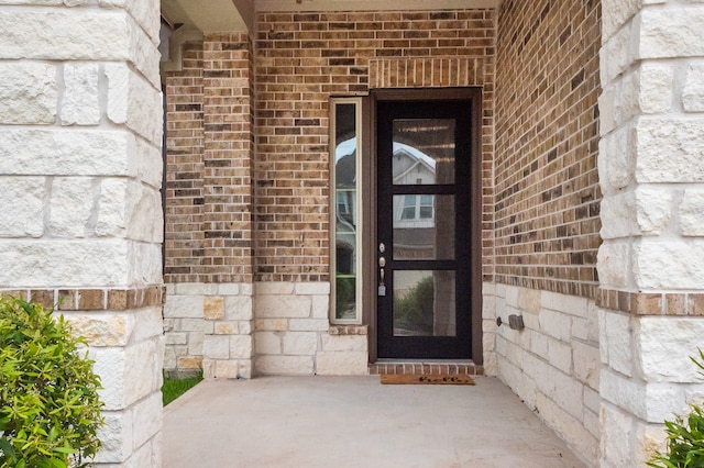 10723 Bridgeport Path Ct, Missouri City, TX 77459 - view of exterior entry featuring brick siding and stone siding