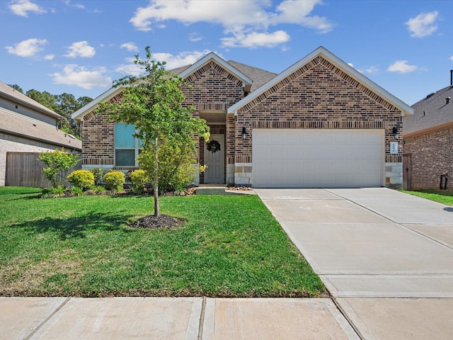 1676 Happy Valley St, Montgomery, TX 77316 - ranch-style house featuring brick siding, an attached garage, and driveway