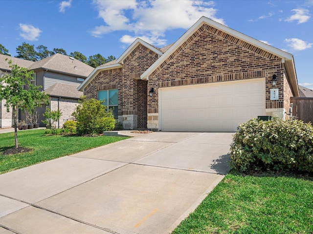 1676 Happy Valley St, Montgomery, TX 77316 - ranch-style home with brick siding, an attached garage, concrete driveway, and a front yard