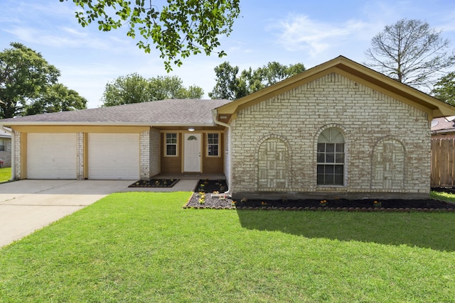 ranch-style home featuring roof with shingles, driveway, a front yard, brick siding, and a garage