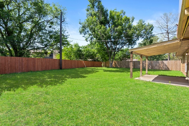 view of yard with a fenced backyard