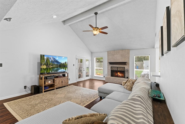 living room featuring dark wood-style flooring, beam ceiling, a fireplace, baseboards, and high vaulted ceiling