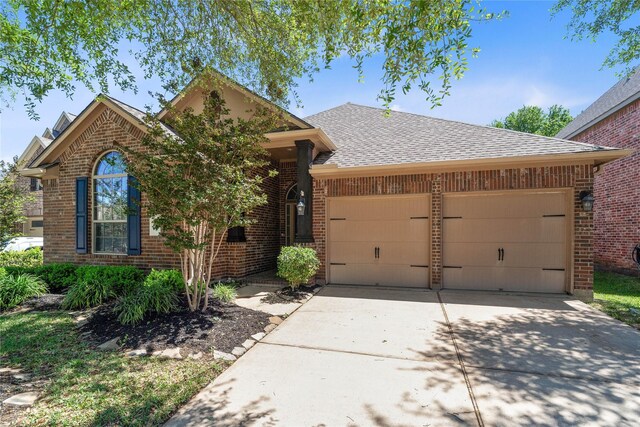 11126 Celano Dr, Richmond, TX 77406 - view of front of home with a garage, brick siding, concrete driveway, and a shingled roof