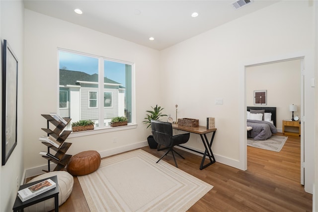 office with wood finished floors, baseboards, visible vents, and recessed lighting