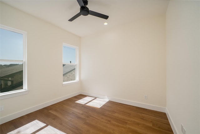 unfurnished room with recessed lighting, baseboards, a ceiling fan, and wood finished floors