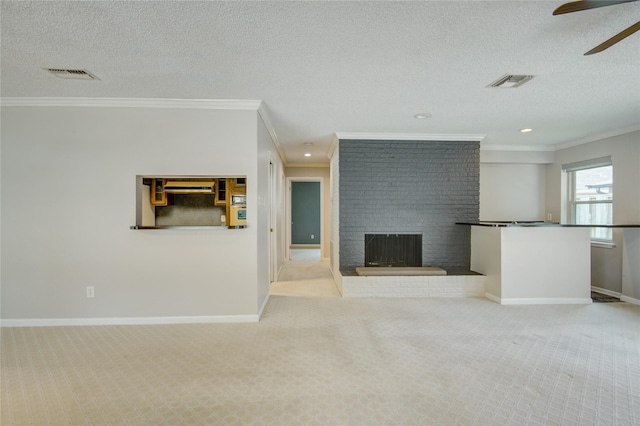 unfurnished living room featuring carpet flooring, visible vents, and ornamental molding