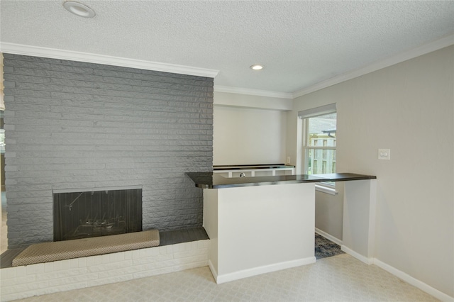 kitchen featuring crown molding, a brick fireplace, carpet, recessed lighting, and baseboards
