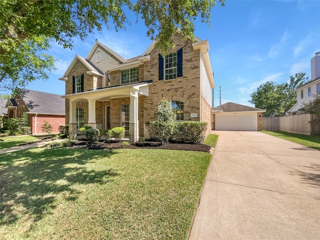 7206 Fiesta Flower, Katy, TX 77494 - traditional-style home with a porch, fence, a front lawn, brick siding, and a garage