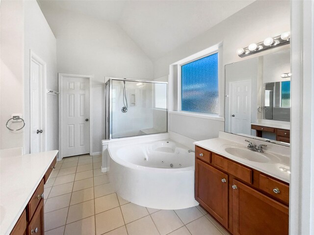 7206 Fiesta Flower, Katy, TX 77494 - full bathroom with vanity, vaulted ceiling, tile patterned flooring, a shower stall, and a tub with jets