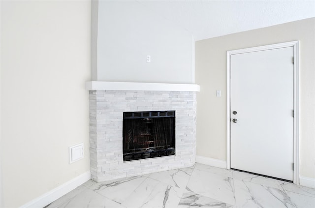 13723 Rocky Bluff Dr, Houston, TX 77085 - unfurnished living room featuring marble look tile flooring and a fireplace