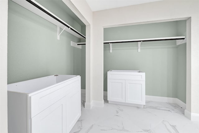 13723 Rocky Bluff Dr, Houston, TX 77085 - washroom featuring light marble finish flooring and baseboards
