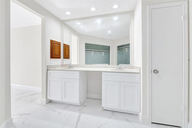 13723 Rocky Bluff Dr, Houston, TX 77085 - bathroom with a closet, double vanity, marble finish flooring, and recessed lighting