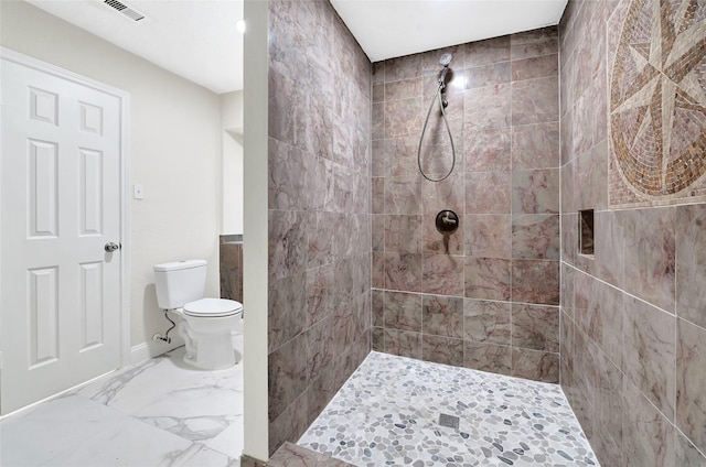 13723 Rocky Bluff Dr, Houston, TX 77085 - bathroom featuring tiled shower and marble finish floors