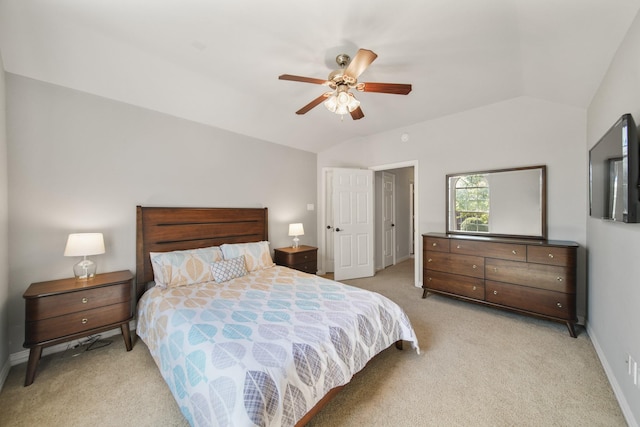 bedroom featuring vaulted ceiling, light carpet, baseboards, and a ceiling fan