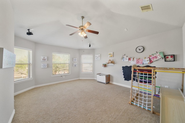 carpeted bedroom with baseboards and a ceiling fan
