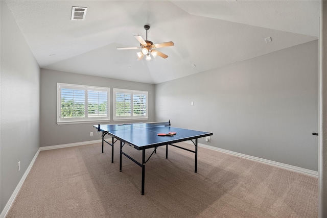 recreation room with lofted ceiling, baseboards, visible vents, ceiling fan, and light colored carpet