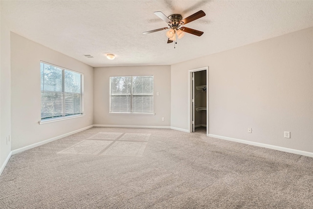 514 Remington Green Ct, Houston, TX 77073 - empty room with light carpet, baseboards, a textured ceiling, and a ceiling fan